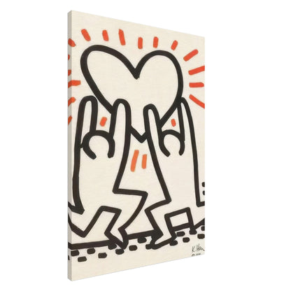 Keith Haring Canvas Print featuring two black outlined dancing figures beneath a large heart with red-orange rays on a cream background.